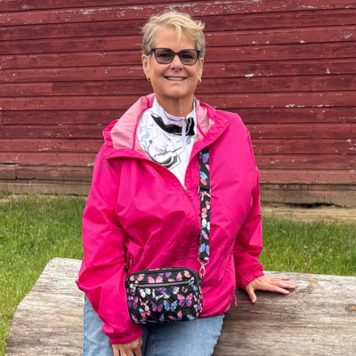 Member Karalene sitting on a bench